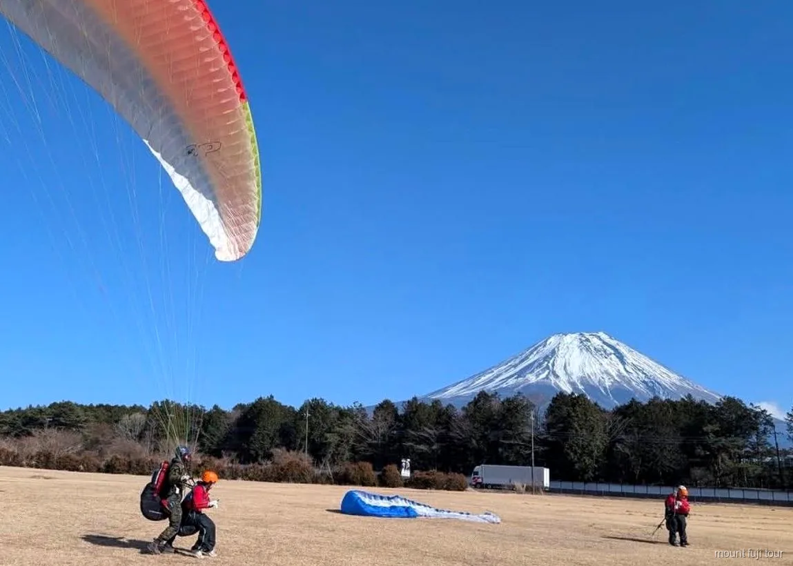 Green fields of the Asagiri Plateau with Mount Fuji behind